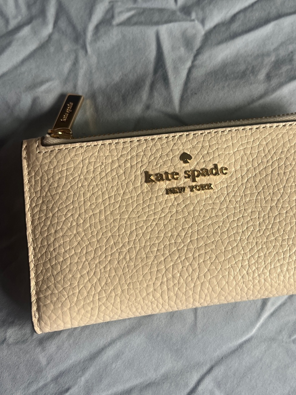 Kate Spade Cream White/Pink Pebbled Leather Bifold Wallet with Gold Logo